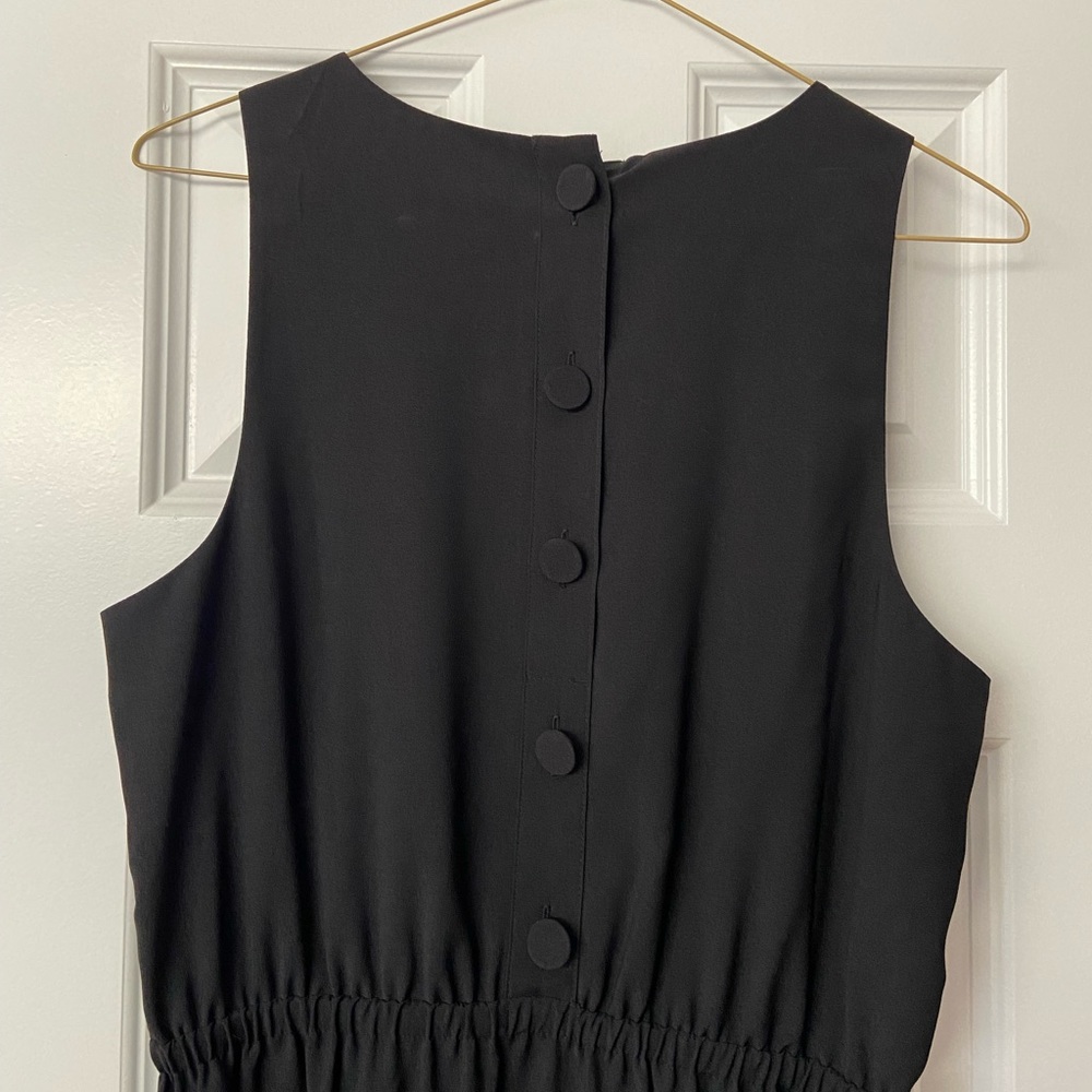 JCrew black dress with buttons on back and side slits. Size 6.